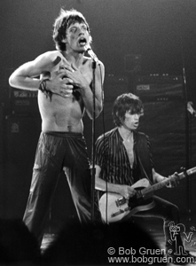 Mick Jagger and Keith Richards of The Rolling Stones with Mick holding heart on stage at The Palladium, NYC. June 1978. © Bob Gruen / www.bobgruen.com Please contact Bob Gruen's studio to purchase a print or license this photo. email: websitemail01@aol.com phone: 212-691-0391